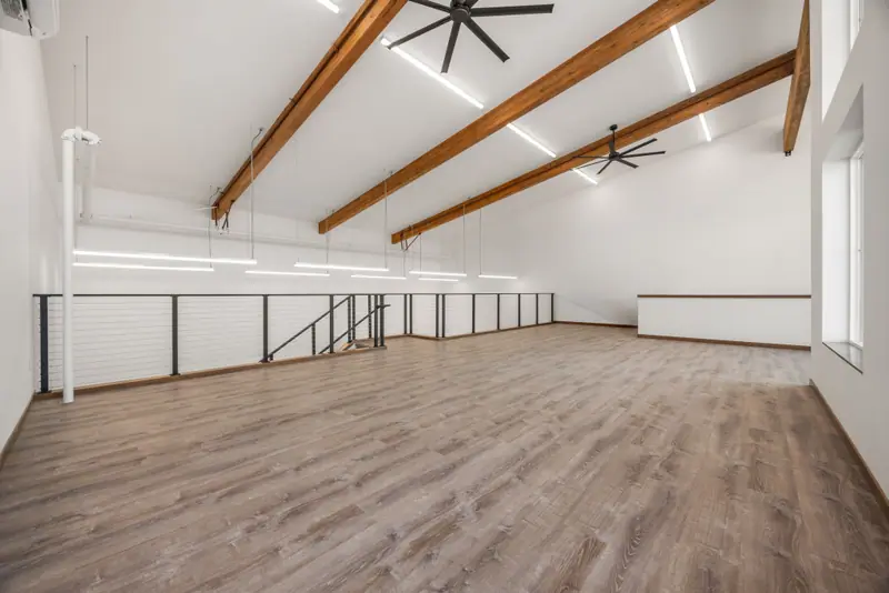 Mezzanine Loft Under Wood Beams